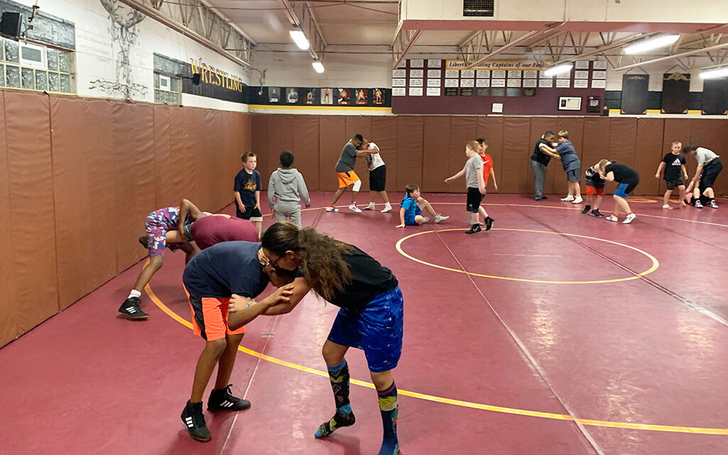 Rhinoh wrestling camp session with youth.